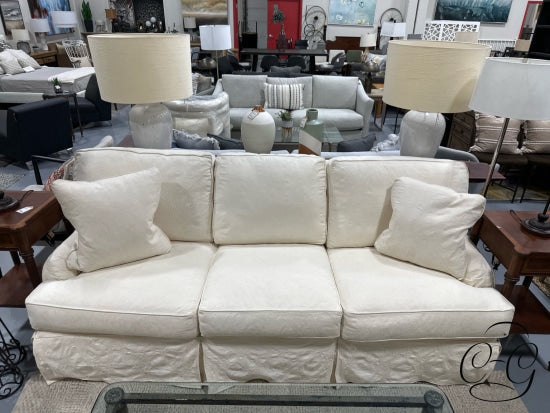 Cream Slip Covered Sofa With 2 Toss Cushions