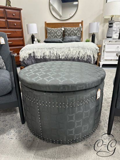 Dark Grey Round Ottoman W/Circle Pattern Fabric Nailhead Detailing