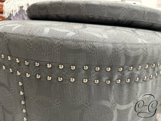 Dark Grey Round Ottoman W/Circle Pattern Fabric Nailhead Detailing