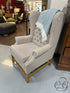 Tufted Taupe Fabric Wingback Chair With Light Wood Base Nailhead Detailing 32x31x45’’ Chair