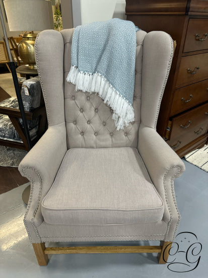 Tufted Taupe Fabric Wingback Chair With Light Wood Base Nailhead Detailing 32x31x45’’ Chair